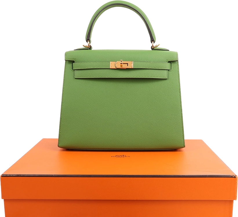 Green Hermès Kelly bag on orange box
